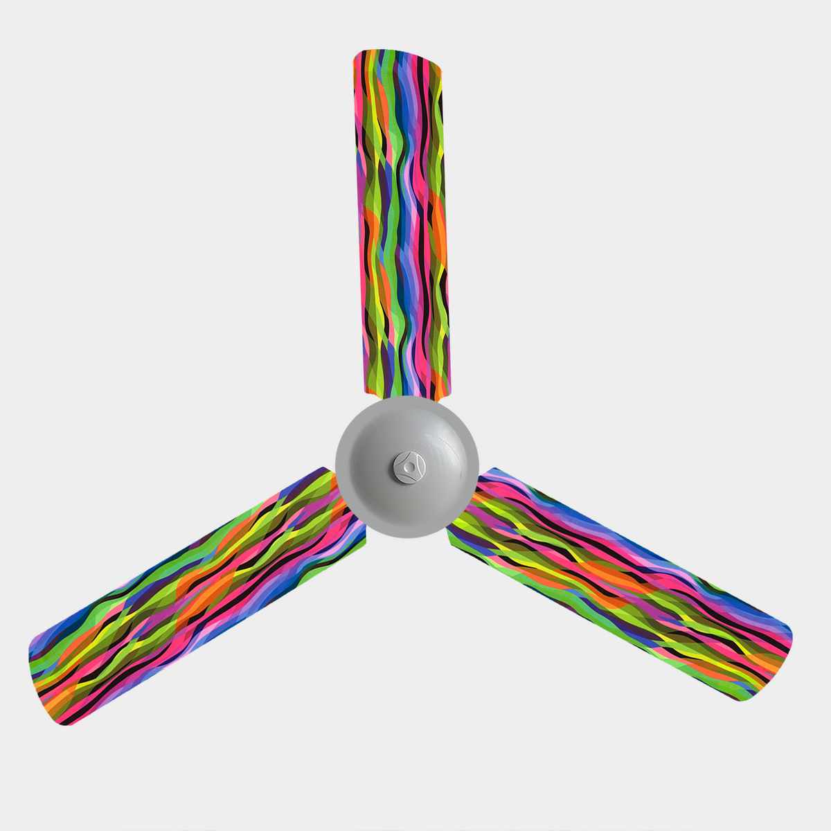 A 3 blade ceiling fan with fabric covers on it which are bright yellow, pink, green, blue and a hint of black wavy stripes